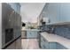 Modern kitchen with stainless steel appliances, attractive backsplash, and sleek countertops at 8405 Placida Rd # 406, Placida, FL 33946