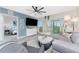 Comfortable living area with balcony access and a view into the bedroom at 8405 Placida Rd # 406, Placida, FL 33946
