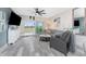 Bright and inviting living room featuring a sliding glass door to a balcony at 8405 Placida Rd # 406, Placida, FL 33946