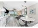 Bright open floor plan living room with access to the outdoor balcony at 8405 Placida Rd # 406, Placida, FL 33946