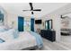 Well-lit main bedroom with king bed, ensuite bath, and view to the living room at 8405 Placida Rd # 406, Placida, FL 33946