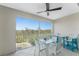 Outdoor patio with table and seating and beautiful view of mature trees at 8405 Placida Rd # 406, Placida, FL 33946