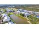 Aerial view of several buildings showcasing the waterfront location and neighborhood amenities at 8411 Placida Rd # 404, Placida, FL 33946
