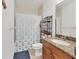 Practical bathroom featuring tile floors, shower, and wood cabinet vanity with granite countertop at 8411 Placida Rd # 404, Placida, FL 33946