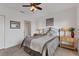 Cozy bedroom with carpeted floors, an iron bed frame, and matching nightstands at 8411 Placida Rd # 404, Placida, FL 33946