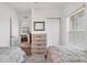 Clean bedroom featuring twin beds, carpeted floors, and a view to the living area at 8411 Placida Rd # 404, Placida, FL 33946