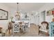Charming dining area with tiled floors, table with four chairs, and access to kitchen and living room at 8411 Placida Rd # 404, Placida, FL 33946