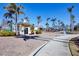 Welcoming entrance to the community, surrounded by lush landscaping and palm trees at 8411 Placida Rd # 404, Placida, FL 33946