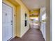 Condo hallway featuring unit number, a view of the outside, and an exit sign at 8411 Placida Rd # 404, Placida, FL 33946