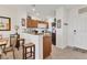 Cozy kitchen features granite counters, wood cabinets, stainless steel appliances, and convenient breakfast bar at 8411 Placida Rd # 404, Placida, FL 33946