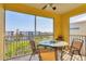 Screened-in patio with seating and a view of the complex at 8411 Placida Rd # 404, Placida, FL 33946