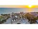 Stunning beachfront home at sunset, featuring a pristine sandy beach and clear ocean views at 8500 Manasota Key Rd, Englewood, FL 34223