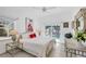 Bright bedroom with tile floor, large windows, and a view of the outdoor swimming pool at 8500 Manasota Key Rd, Englewood, FL 34223