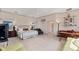 Bright main bedroom with tile floors, sitting area, and an ensuite bathroom at 8500 Manasota Key Rd, Englewood, FL 34223