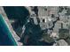 Stunning aerial view of the property's location in relation to Lemon Bay, beaches, and local businesses at 859 E 2Nd St, Englewood, FL 34223