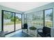 The light and airy patio offers serene views of the front yard, and features tile floor and neutral paint at 859 E 2Nd St, Englewood, FL 34223