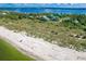 Experience coastal living with panoramic ocean views and private beach access at 9200 Little Gasparilla # 203, Placida, FL 33946