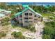 Unique angle of a home offering direct beach access and captivating ocean views at 9200 Little Gasparilla # 203, Placida, FL 33946