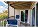 Balcony view with seating, slider doors to interior space at 9200 Little Gasparilla # 203, Placida, FL 33946