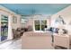Bright living room with comfortable seating and balcony access, perfect for relaxing at 9200 Little Gasparilla # 203, Placida, FL 33946
