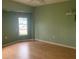 Spacious bedroom with hardwood floors and a window to let in natural light at 1 Clubhouse Rd, Rotonda West, FL 33947