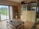 Well lit living room featuring a large window, built in display shelving, and a coffee table at 1 Clubhouse Rd, Rotonda West, FL 33947