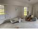 Bare living room with multiple windows for natural light and potential renovations and updates at 1 Clubhouse Rd, Rotonda West, FL 33947