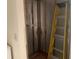 Exposed interior wall studs with ladder at 1 Clubhouse Rd, Rotonda West, FL 33947