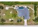 Overhead view of property, showing a large house, spacious layout, pool, generous landscaping, and circular driveway at 1002 Rotonda Cir, Rotonda West, FL 33947
