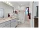 Bathroom featuring a walk-in shower, tiled floors, and modern fixtures at 1002 Rotonda Cir, Rotonda West, FL 33947