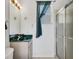 Charming bathroom with a green vanity top, glass shower, and decorative starfish accents at 1002 Rotonda Cir, Rotonda West, FL 33947