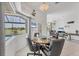 Cozy dining area with golf course view, seamlessly integrated into the light-filled, open-concept living space at 1002 Rotonda Cir, Rotonda West, FL 33947
