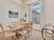 Bright dining room featuring a large window with natural light, perfect for Gathering gatherings at 1002 Rotonda Cir, Rotonda West, FL 33947