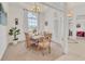 Elegant dining room with a large window offering ample natural light, ideal for entertaining guests at 1002 Rotonda Cir, Rotonda West, FL 33947