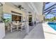 A spacious lanai offers outdoor dining and lounging, with a pool view and seamless indoor-outdoor living at 1002 Rotonda Cir, Rotonda West, FL 33947