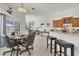Inviting open-concept living space with breakfast nook and bar seating, perfect for relaxed living at 1002 Rotonda Cir, Rotonda West, FL 33947
