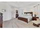 Spacious main bedroom featuring a trey ceiling, carpet floors, and bright natural light at 1002 Rotonda Cir, Rotonda West, FL 33947