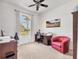 Spacious office with natural light, desk, chair, and a comfortable sitting area at 1002 Rotonda Cir, Rotonda West, FL 33947