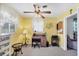 Cozy office space with yellow walls, desk, natural light, and comfortable seating at 1040 Caples St, Englewood, FL 34223