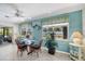 Charming dining area with a glass table, four chairs, and windows providing natural light at 1040 Caples St, Englewood, FL 34223