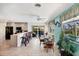 Bright kitchen and dining area with large windows and access to the outdoor patio at 1040 Caples St, Englewood, FL 34223