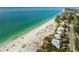 Gorgeous coastal aerial view of beachfront homes along the pristine shoreline with turquoise gulf water at 10521 Amberjack Way # 303, Englewood, FL 34224