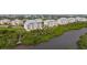 Beautiful condominiums overlooking lush greenery and a serene river, offering a tranquil living environment at 10521 Amberjack Way # 303, Englewood, FL 34224