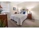 Comfortable bedroom featuring a cozy bed and soft, natural lighting at 10521 Amberjack Way # 303, Englewood, FL 34224