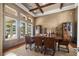 Dining room with high ceilings, large windows, and stylish decor at 10521 Amberjack Way # 303, Englewood, FL 34224