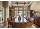 View of the large formal dining room with a hardwood floor and large wood table at 10521 Amberjack Way # 303, Englewood, FL 34224