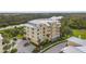 Condominium complex near a waterway, offering convenient parking and picturesque landscaping at 10521 Amberjack Way # 303, Englewood, FL 34224