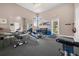 Clean fitness center with various free weights, weight machines, mirrors, and workout space at 10521 Amberjack Way # 303, Englewood, FL 34224