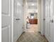 Hallway with access to rooms and a decorative rug at 10521 Amberjack Way # 303, Englewood, FL 34224