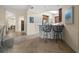 Kitchen area with bar seating and tile floors at 10521 Amberjack Way # 303, Englewood, FL 34224